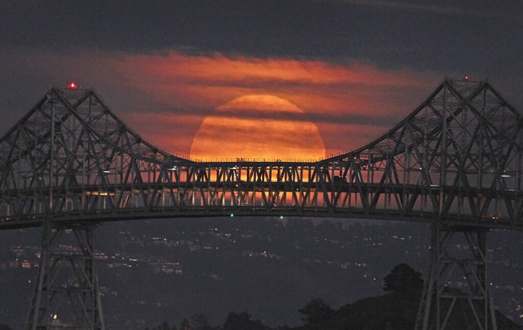 China Supermoon A Supermoon rises in the night sky in Beijing, Thursday, Aug. 11, 2022. (AP Photo/Ng Han Guan)