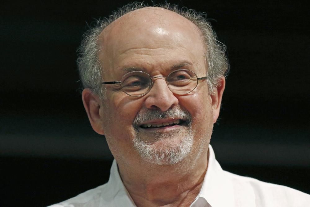FILE - Author Salman Rushdie appears during the Mississippi Book Festival in Jackson, Miss., on Aug. 18, 2018. Rushdie, whose writing led to death threats, has been attacked on stage at an event in western New York (AP Photo/Rogelio V. Solis, File)