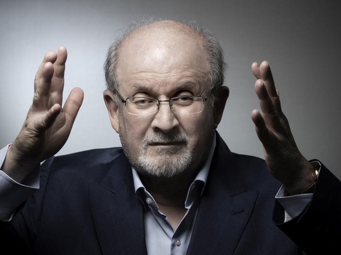 In this file photo taken on September 10, 2018, British author Salman Rushdie poses during a photo session in Paris. - Rushdie, whose controversial writings made him the target of a fatwa that forced him into hiding, was stabbed in the neck by an attacker on stage Friday in western New York state, according to New York State Police. The attacked is in custody. (Photo by JOEL SAGET / AFP)