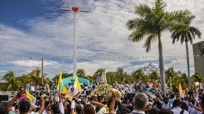Nicaragua Church Faithful take part in a procession to the Cathedral in Managua, Nicaragua, Saturday, Aug. 13, 2022. The Catholic Church has called on the faithful to peacefully arrive at the Cathedral in Managua Saturday after National Police denied permission for a planned religious procession on