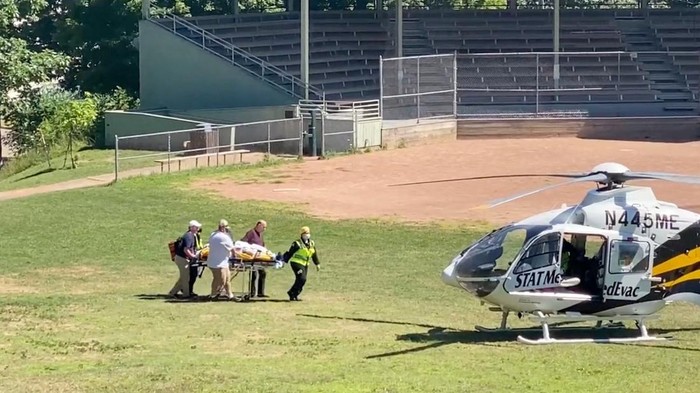 Author Salman Rushdie is transported to a helicopter after he was stabbed on stage before his scheduled speech at the Chautauqua Institution, Chautauqua, New York, U.S., August 12, 2022, in this screengrab taken from a social media video. TWITTER @HoratioGates3 /via REUTERS  THIS IMAGE HAS BEEN SUPPLIED BY A THIRD PARTY. MANDATORY CREDIT.