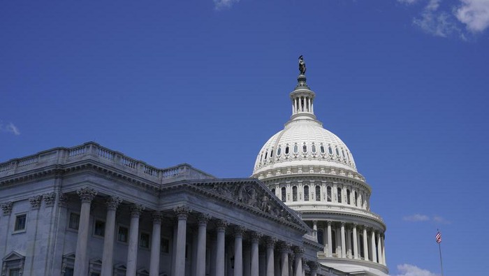 FILE - The sun shines on the dome of Capitol Hill in Washington, Friday, Aug. 12, 2022. A man drove his car into a barricade near the U.S. Capitol early Sunday, Aug. 14, 2022, and then began firing gunshots in the air before fatally shooting himself, police said. (AP Photo/Susan Walsh, File)