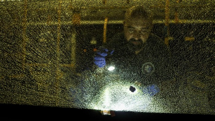 An Israeli police officer checks a bus following an incident in Jerusalem August 14, 2022. REUTERS/Ammar Awad