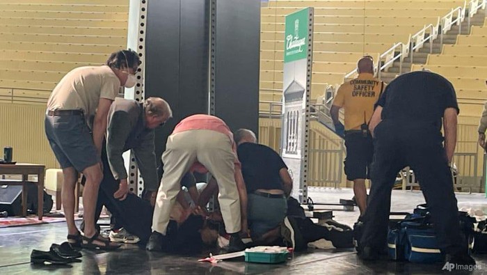 Author Salman Rushdie is tended to after he was attacked during a lecture on Aug 12, 2022, at the Chautauqua Institution in New York.