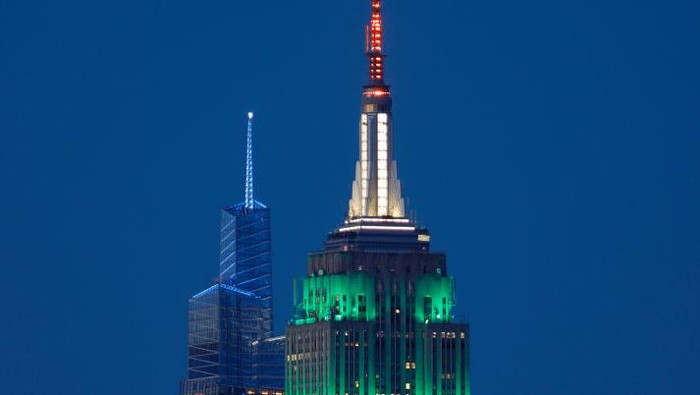 JERSEY CITY, NJ - AUGUST 15: The Empire State Building is lit in the colors of the flag of India, which is marking its 75th year of independence, in New York City on August 15, 2022, as seen from Jersey City, New Jersey. (Photo by Gary Hershorn/Getty Images)