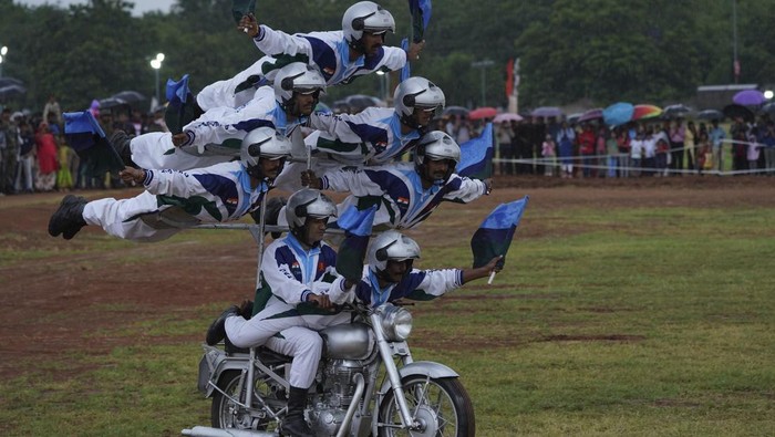 Indian army soldiers display their skills on motorcycles on the eve of Independence Day  in Hyderabad, India, Sunday, Aug. 14, 2022.
