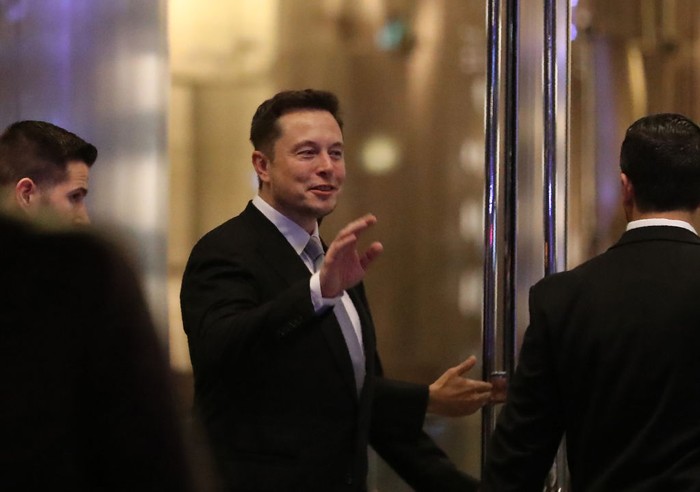 Elon Musk, the co-founder and chief executive of Electric carmaker Tesla, gestures during a ceremony in Dubai on February 13, 2017.
Tesla announced the opening of a new Gulf headquarters in Dubai, aiming to conquer an oil-rich region better known for gas guzzlers than environmentally friendly motoring. / AFP PHOTO / KARIM SAHIB        (Photo credit should read KARIM SAHIB/AFP via Getty Images)