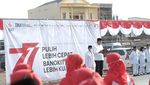 Potret Upacara HUT RI Askrindo Bersama Warga Kampung Kerang Hijau
