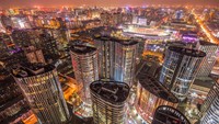 Dari Beijing, China, ada panorama SOHO Area yang memperlihatkan gedung-gedung dengan cahaya lampu warna-warni yang bikin betah berlama-lama dengan suasananya.