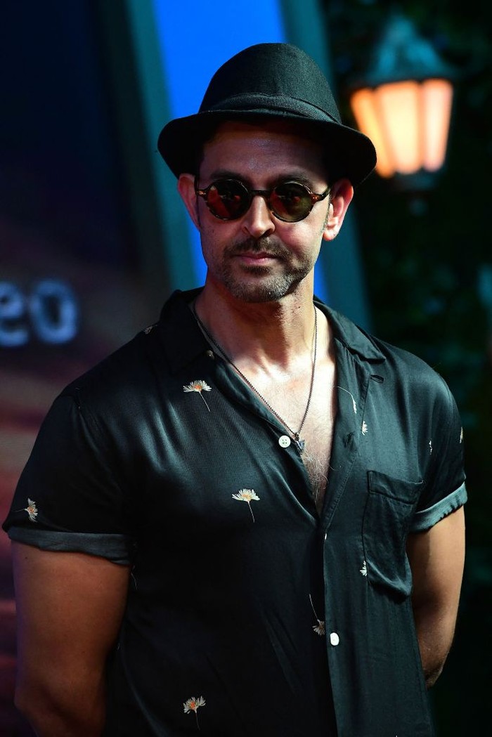 1242575098 Bollywood actor Hrithik Roshan attends the press conference for Amazon upcoming American fantasy television series The Lord of the Rings: The Rings of Power in Mumbai on August 18, 2022. (Photo by Sujit JAISWAL / AFP) (Photo by SUJIT JAISWAL/AFP via Getty Images)