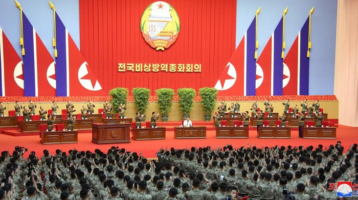 North Koreas leader Kim Jong Un poses for a photo with  Korean Peoples Army medics during a meeting to recognise their contributions in fighting the coronavirus disease (COVID-19) pandemic in Pyongyang, North Korea, August 18, 2022 in this photo released by North Koreas Korean Central News Agency (KCNA). KCNA via REUTERS    ATTENTION EDITORS - THIS IMAGE WAS PROVIDED BY A THIRD PARTY. REUTERS IS UNABLE TO INDEPENDENTLY VERIFY THIS IMAGE. NO THIRD PARTY SALES. SOUTH KOREA OUT. NO COMMERCIAL OR EDITORIAL SALES IN SOUTH KOREA.     TPX IMAGES OF THE DAY