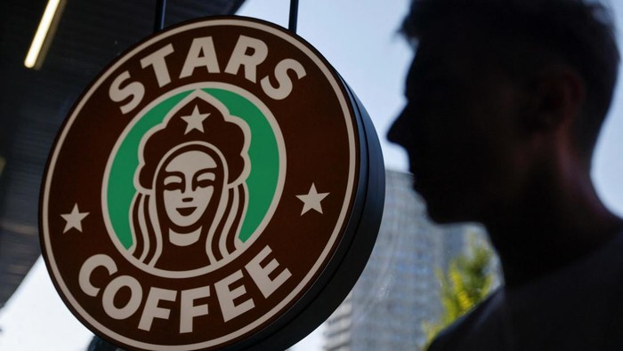 The logo is seen at the launching of the new coffee shop 