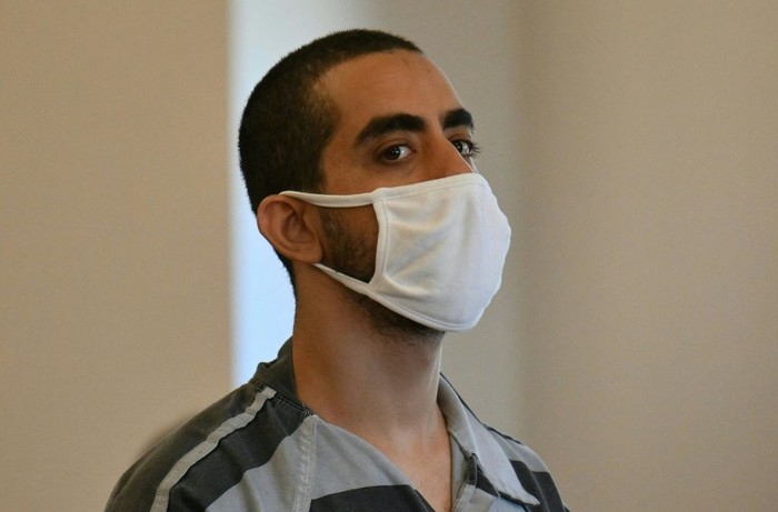 Hadi Matar, the man accused in the attempted murder of British author Salman Rushdie, leaves court after a procedural hearing at Chautauqua County Courthouse in Mayville, New York on August 18, 2022. - Matar has pleaded not guilty to attempted murder charges after being accused of stabbing British author Salman Rushdie multiple times on stage during a literary event at the Chautauqua Institution. The severely injured author is recovering and showing signs of his 