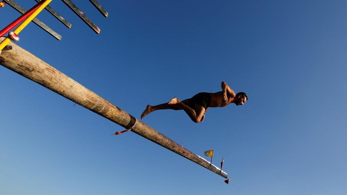 A competitor runs up the 