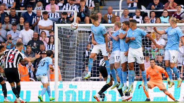 Newcastle Uniteds Kieran Trippier (left) scores their sides third goal of the game during the Premier League match at St. James Park, Newcastle. Picture date: Sunday August 21, 2022. (Photo by Owen Humphreys/PA Images via Getty Images)