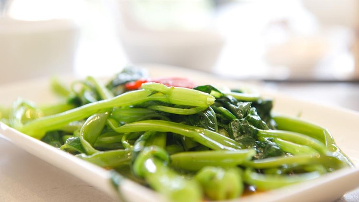 Close-up of a dish of stir fry water convolvulus, Chinese style.