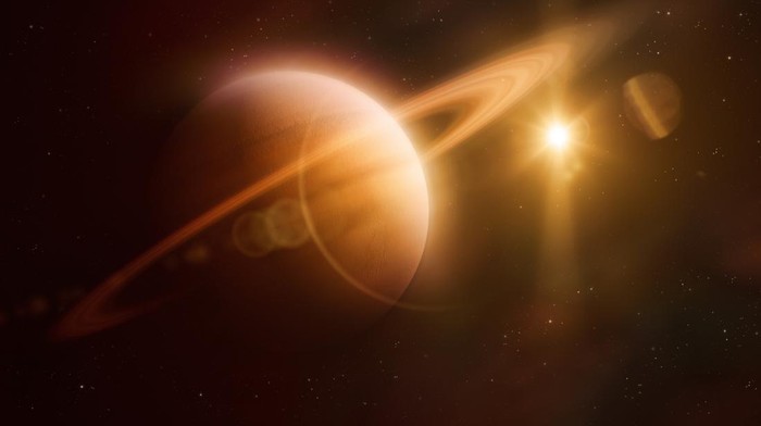 Saturn and sun in outer space
