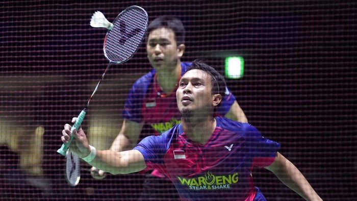 Mohammad Ahsan of Indonesia, with Hendra Setiawan, plays a return during a badminton game of the mens doubles against Mark Lamsfuss and Marvin Seidel of Germany in the BWF World Championships in Tokyo, Thursday, Aug. 25, 2022. (AP Photo/Hiro Komae)
