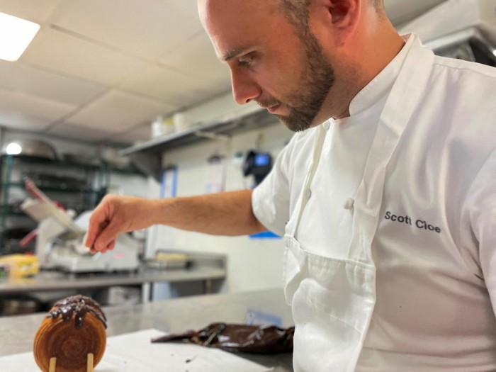 Lafayette Grand Cafe & Bakery executive pastry chef Scott Cioe works on the preparation of Supremes, at Lafayette Grand Cafe & Bakery, in New York, U.S., August 24, 2022. REUTERS/Roselle Chen