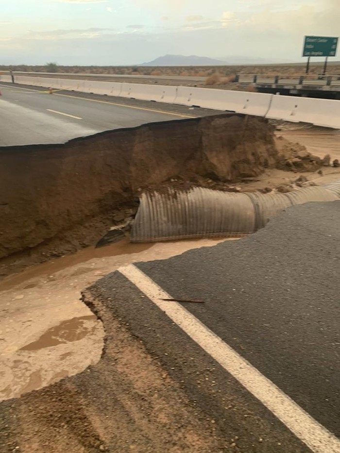 This photo provided by Caltrans shows a washed out section of Interstate 10 near Desert Center, Calif., Wednesday, Aug. 24, 2022. Eastbound traffic on Interstate 10 in the Southern California desert was blocked Thursday after flash floods washed out the roadway. The latest round of flooding caused by monsoonal thunderstorms hit Wednesday evening and also impacted other desert highways. (Caltrans via AP)
