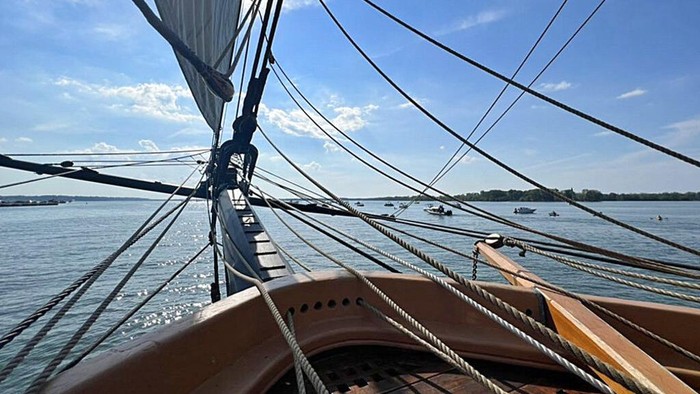 This is a  view off the bow of the U.S. Brig Niagara,  in Lake Erie, prior to the Parade of Sail on Presque Isle Bay, on Thursday, Aug. 25, 2022, that opened the 2022 Tall Ships Erie festival on the bayfront in Erie, Pa. The U.S. Brig Niagara, one of seven tall ships at the festival, is Erie's flagship, is a working tall ship and is a floating museum that is part of the Pennsylvania Museum Commission.(Baylee Demuth/Erie Times-News via AP)