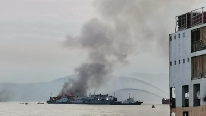 In this handout photo provided by the Philippine Coast Guard, smoke is seen from the M/V Asia Philippines, an inter-island cargo and passenger vessel, as it caught fire while it was approaching Batangas port, southern Philippines on Friday Aug. 26, 2022. A Philippine ferry carrying 82 passengers and crew caught fire as it was approaching a port south of Manila on Friday. coast guard officials said. Most of the passengers and crew have been rescued while search operations continue for the others missing. (Philippine Coast Guard via AP)