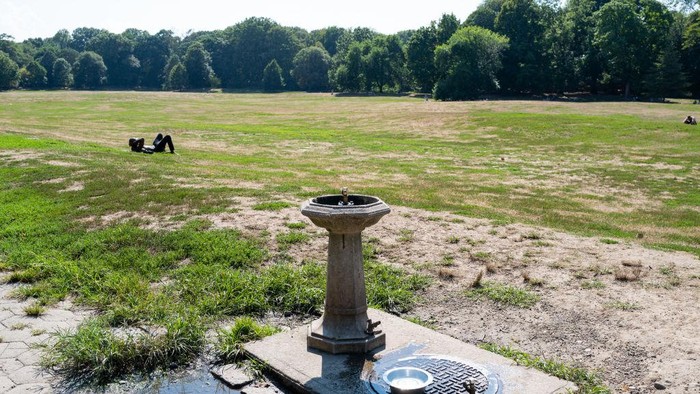 NEW YORK, NEW YORK - AUGUST 29: People sit by the water at a Brooklyn park on August 29, 2022 in New York City. According to the National Drought Mitigation Center and the National Weather Service, all of New York City is facing drought conditions. Do to an unusually hot and dry summer, parts of southern Brooklyn, Queens and all of Staten Island are experiencing severe drought conditions. New York City, which usually see  saw just 8.82 inches of rainfall. New York City usually gets nearly 13 inches of rain during the summer, this season saw that drop to 8.82 inches of rainfall. (Photo by Spencer Platt/Getty Images)