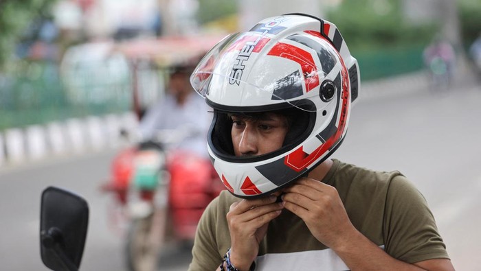 Motorcycle helmets manufactured by Shellios Technolabs, that they claim is fitted with filters and a fan at the back of the helmet, is pictured at the assembling unit of its factory in an industrial area, in New Delhi, India, August 23, 2022. REUTERS/Anushree Fadnavis