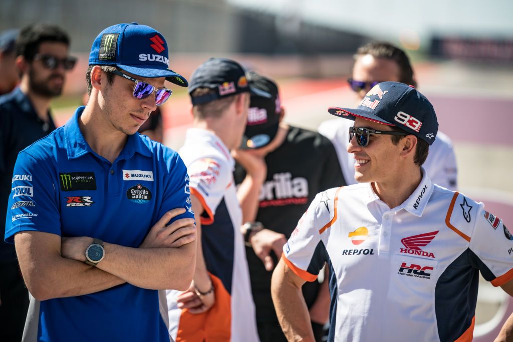 AUSTIN, TEXAS - APRIL 07: Marc Marquez of Spain and Repsol Honda Team speaks with Joan Mir of Spain and Team SUZUKI ECSTAR ahead of the MotoGP of USA at the Circuit Of The Americas on April 07, 2022 in Austin, Texas. (Photo by Steve Wobser/Getty Images)