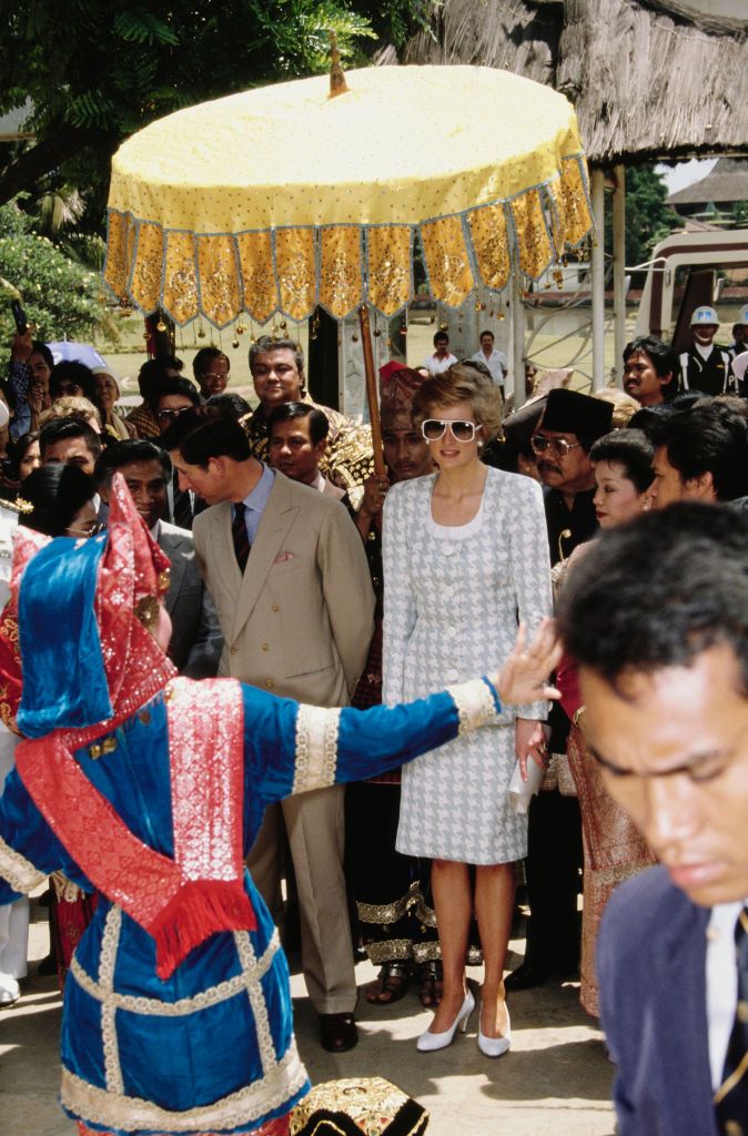 Prince Charles and Diana, Princess of Wales  (1961 - 1997) visit the Taman Mini recreational area in Jakarta, Indonesia, November 1989.  Diana is wearing a suit by Catherine Walker.  (Photo by Jayne Fincher/Princess Diana Archive/Getty Images)