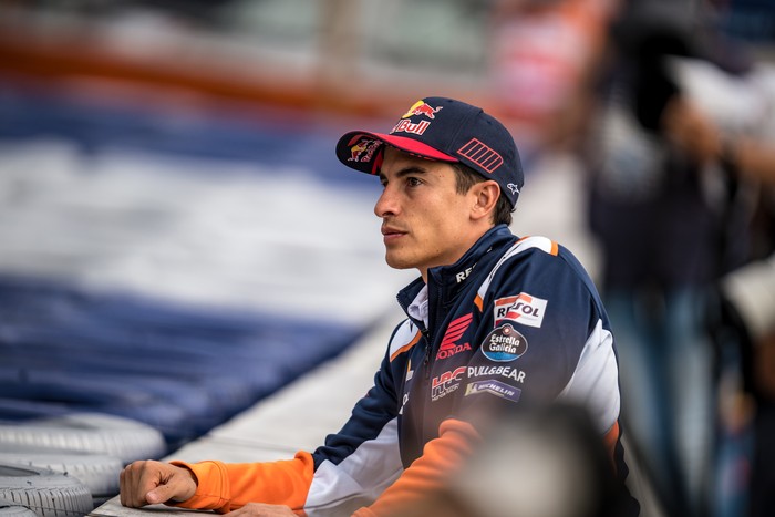 SPIELBERG, AUSTRIA - AUGUST 19: Marc Marquez of Spain and Repsol Honda Team watches the practice from the service road during the free practice of the CryptoDATA MotoGP of Austria at Red Bull Ring on August 19, 2022 in Spielberg, Austria. (Photo by Steve Wobser/Getty Images)