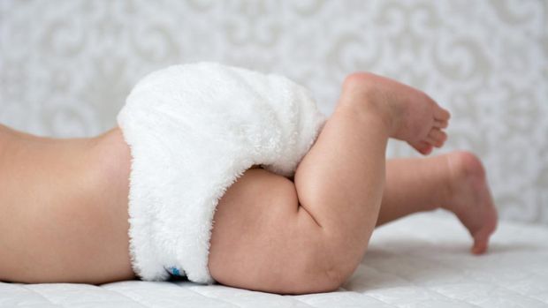 Baby in a white reusable nappy