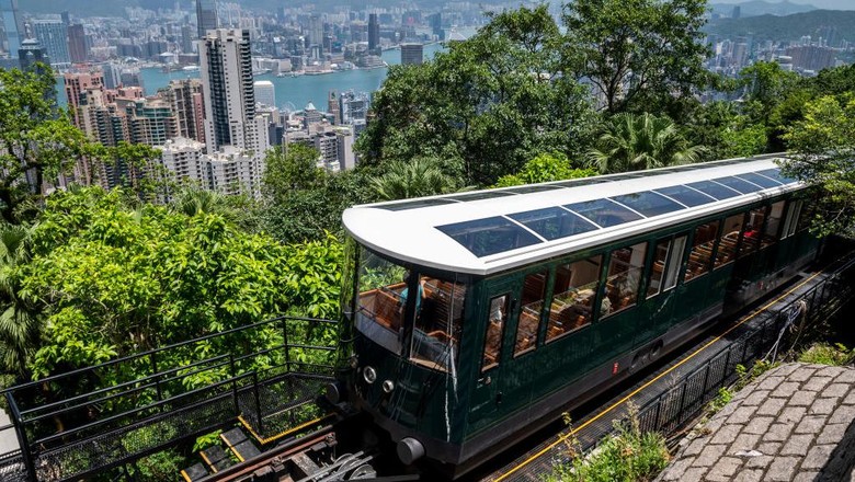 The 6th generation Peak Tram arriving at the Peak on August 27, 2022 in Hong Kong, China. The 6th Generation Peak Tram opens to the public today, after one year of renovations. (Photo by Vernon Yuen/NurPhoto via Getty Images)