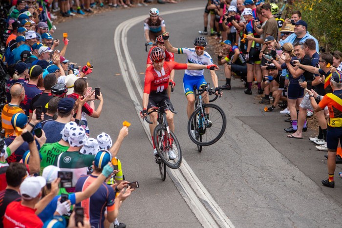 1418517278 COLLΓU FANCUAYA, SPAIN - AUGUST 27: Clement Russo of France and Team ArkΓ©a - Samsic makes wheelie while fans cheer during the 77th Tour of Spain 2022, Stage 8 a 153,4km stage from Pola de Laviana to CollΓ‘u Fancuaya 1084m / #LaVuelta22 / #WorldTour / on August 27, 2022 in CollΓ‘u Fancuaya, Spain. (Photo by Justin Setterfield/Getty Images)