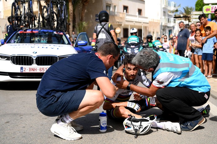 CABO DE GATA, SPAIN - AUGUST 31: Julian Alaphilippe of France and Team Quick-Step - Alpha Vinyl reacts to a fall and is assisted by the medical team during the 77th Tour of Spain 2022, Stage 11 a 191,2km stage from ElPozo Alimentación - Alhama de Murcia to Cabo de Gata / #LaVuelta22 / #WorldTour / on August 31, 2022 in Cabo de Gata, Spain. (Photo by Justin Setterfield/Getty Images)