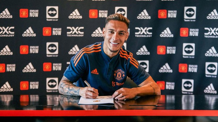 MANCHESTER, ENGLAND - SEPTEMBER 01:  New Manchester United signing Antony signs for the club at Carrington Training Ground on September 01, 2022 in Manchester, England. (Photo by Manchester United/Manchester United via Getty Images)