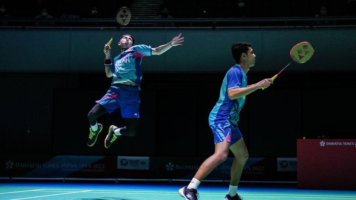 OSAKA, JAPAN - AUGUST 31: Fajar Alfian (R) and Muhammad Rian Ardianto of Indonesia compete in the Mens Doubles First Round match against Akira Koga and Taichi Saito of Japan during day two of Daihatsu Yonex Japan Open at Maruzen Intec Arena Osaka on August 31, 2022 in Osaka, Japan. (Photo by Shi Tang/Getty Images)