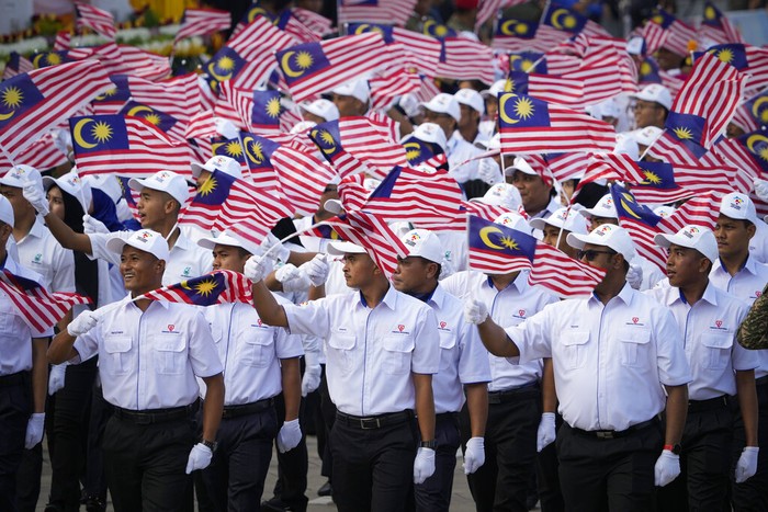 Royal Malaysia Army armed carrier parade in formation during the 65th National Day celebrations at Independence Square in Kuala Lumpur, Malaysia, Wednesday, Aug. 31, 2022. The Federation of Malaya gained its independence from Britain on Aug. 31, in 1957. (AP Photo/Vincent Thian)