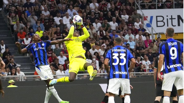 AC Milans Olivier Giroud attempts to score during a Serie A soccer match between AC Milan and Inter Milan at the San Siro stadium in Milan, Italy, Saturday, Sept. 3, 2022. (AP Photo/Luca Bruno)