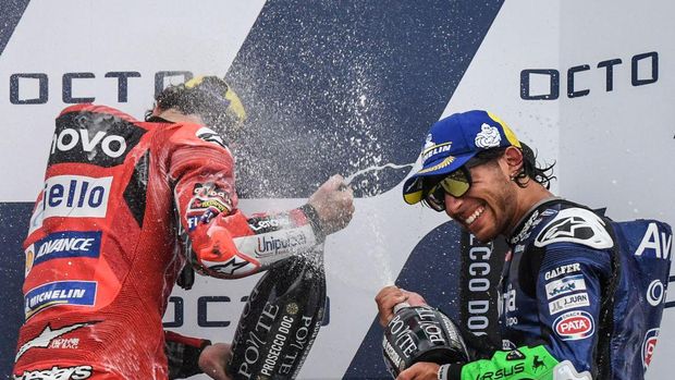Race winner Ducati Italian rider Francesco Bagnaia (L) and third-placed Ducati-Avintia Italian rider Enea Bastianini spray Prosecco wine as they celebrate on the podium after the San Marino MotoGP Grand Prix at the Misano World Circuit Marco-Simoncelli on September 19, 2021 in Misano Adriatico, Italy. (Photo by ANDREAS SOLARO / AFP) (Photo by ANDREAS SOLARO/AFP via Getty Images)