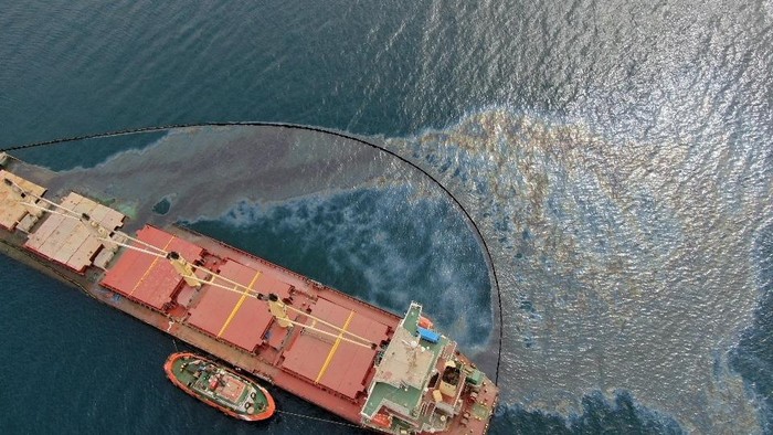 Aerial view shows the extent of the leak by the half sunk cargo ship OS 35 in Catalan Bay after its collision on Wednesday with an LNG tanker near Gibraltar, September 2, 2022. Gibraltar Government/Handout via REUTERS ATTENTION EDITORS - THIS IMAGE WAS PROVIDED BY A THIRD PARTY