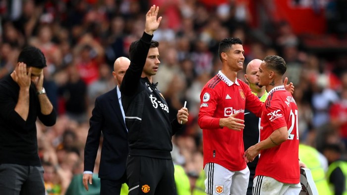 MANCHESTER, ENGLAND - SEPTEMBER 04: Antony of Manchester United interacts with Cristiano Ronaldo of Manchester United after being substituted off during the Premier League match between Manchester United and Arsenal FC at Old Trafford on September 04, 2022 in Manchester, England. (Photo by Shaun Botterill/Getty Images)