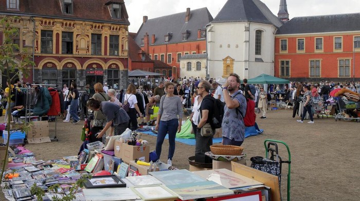 Visitors attend during the annual Braderie in the northern city of Lille, Saturday Sept.2 2022. The Lille flea market is the largest one in Europe and one of the most famoust events in France and beyond its borders. The Lille flea market was canceled for 2 years due to the COVID pandemic. (AP Photo/Michel Spingler)