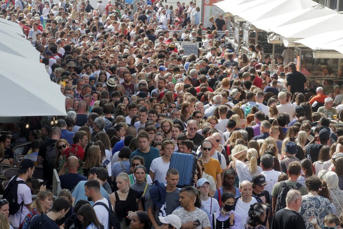 Visitors attend during the annual Braderie in the northern city of Lille, Saturday Sept.2 2022. The Lille flea market is the largest one in Europe and one of the most famoust events in France and beyond its borders. The Lille flea market was canceled for 2 years due to the COVID pandemic. (AP Photo/Michel Spingler)