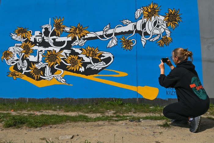 1242971324 A cyclist passes by a pro-Ukrainian mural entitled 'No More Time' created by Polish artist TUSE (Piotr TUSE Jaworski).
More than 25 anti-war and pro-Ukrainian murals were painted on the wall at the Gdask Jasie train station as part of the project 'In solidarity with Ukraine' initiated by the PKM (Pomeranian Metropolitan Railway) and the Gdask Academy of Fine Arts. Most of the authors are students of the Academy of Fine Arts.
Last weekend, another 10 new murals were created, all related to the Russia-Ukraine conflict in 2022.
On Monday, September 05, 2022, in Gdansk, Pomeranian Voivodeship, Poland. (Photo by Artur Widak/NurPhoto via Getty Images)