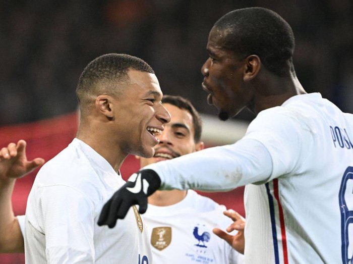 French forward Kylian Mbappe (L) celebrates with French midfielder Paul Pogba (R) after scoring a goal from the penalty-kick during the friendly football match between France and South Africa at Pierre-Mauroy stadium in Villeneuve-dAscq, near Lille, northern France, on March 29, 2022. (Photo by DENIS CHARLET / AFP) (Photo by DENIS CHARLET/AFP via Getty Images)