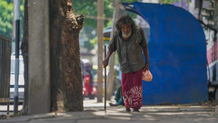 Old man walk in public road on Colombo, sri lanka. September 03, 2022. Sri Lanka is currently facing a political and economic crisis. (Photo by Thilina Kaluthotage/NurPhoto via Getty Images)
