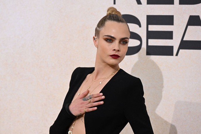 British model Cara Delevingne arrives on May 26, 2022 to attend the annual amfAR Cinema Against AIDS Cannes Gala at the Hotel du Cap-Eden-Roc in Cap d'Antibes, southern France, on the sidelines of the 75th Cannes Film Festival. (Photo by Stefano Rellandini / AFP) (Photo by STEFANO RELLANDINI/AFP via Getty Images)