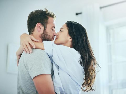 Shot of a young couple sharing an intimate moment in their bedroom