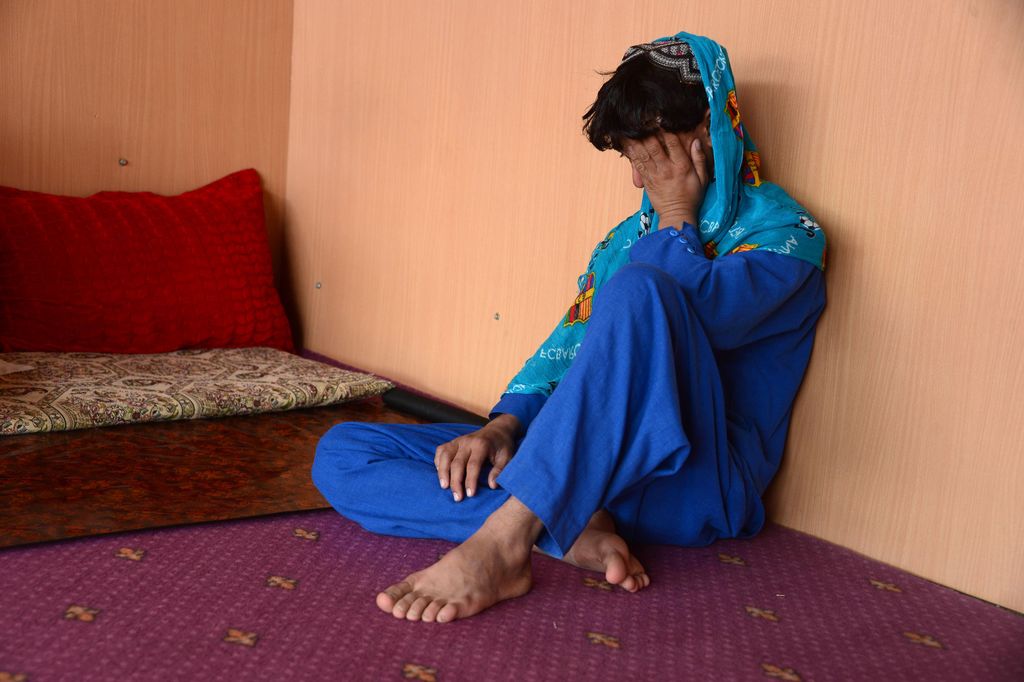 This photograph taken on October 31, 2016 shows an Afghan boy, who was held as a child sex slave, sitting at a restaurant in a unidentified location in Afghanistan.  Quivering with quiet rage, Shirin holds a photo of his teenage brother-in-law, who now lives as the plaything of policemen, just one victim of a hidden epidemic of kidnappings of young boys for institutionalised sexual slavery in Afghanistan. Shirin is among 13 families AFP traced and interviewed across three Afghan provinces who said their children were taken for the pervasive practice of 